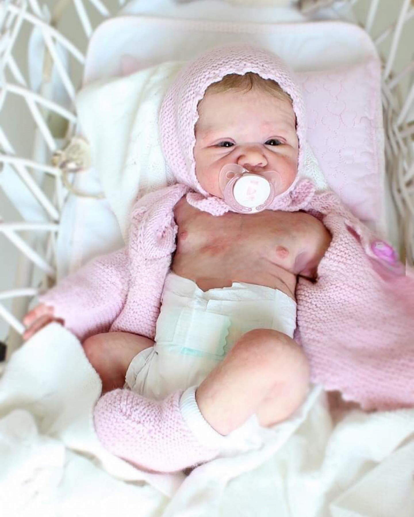 Baby June reborn doll with applied black mohair lashes