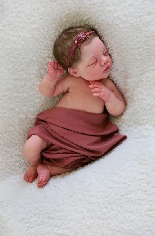 Joanna Joy reborn baby girl with softly rooted brownish hair